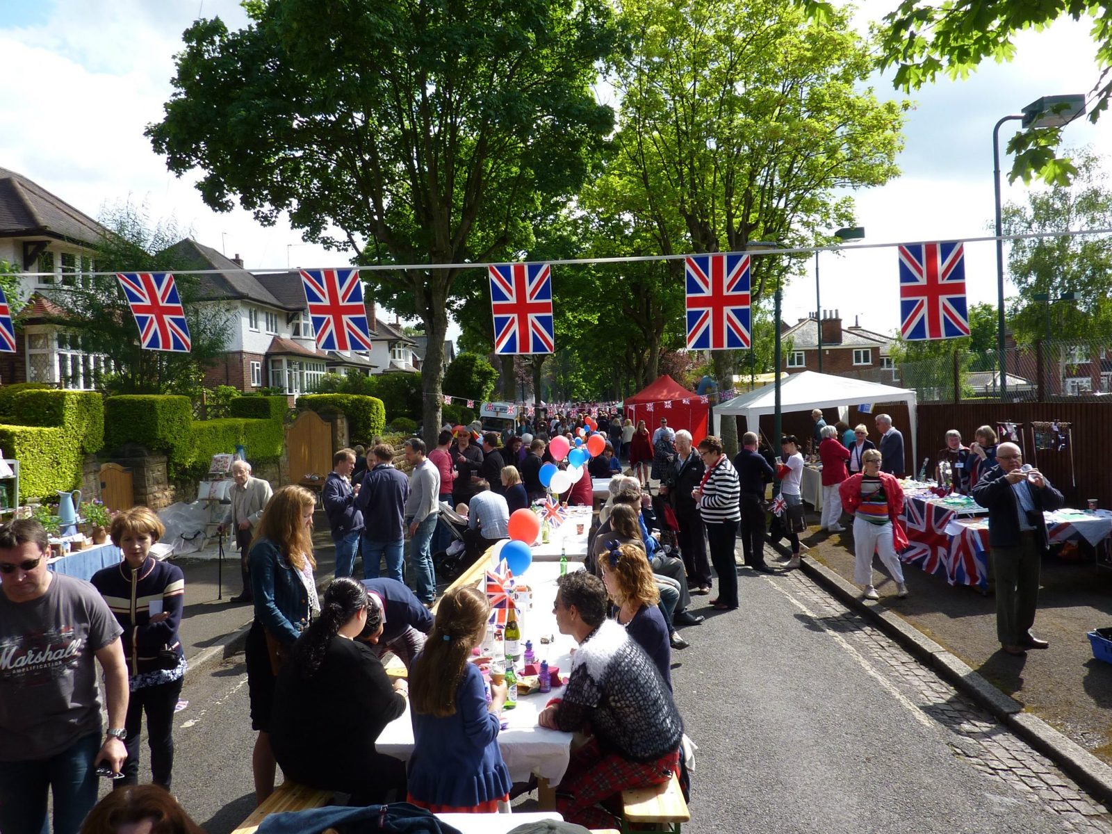 Residents gathered under bunting at a street party